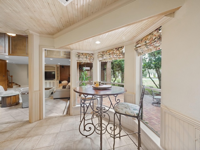 tiled dining room featuring crown molding and wooden ceiling