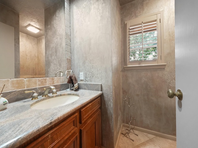 bathroom featuring tile patterned flooring and vanity