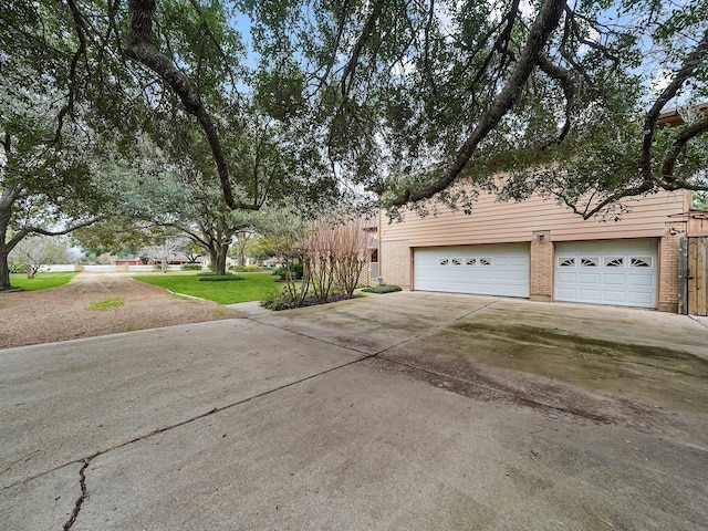 view of side of home featuring a garage