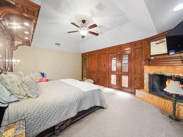 bedroom featuring french doors, ceiling fan, and light carpet