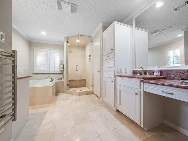 bathroom with tile patterned flooring, vanity, ornamental molding, a textured ceiling, and separate shower and tub