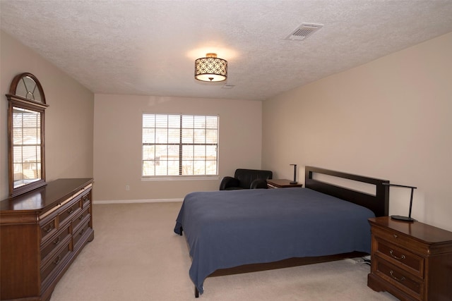 carpeted bedroom with a textured ceiling