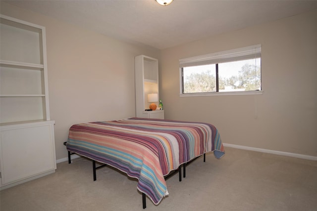 bedroom with light colored carpet