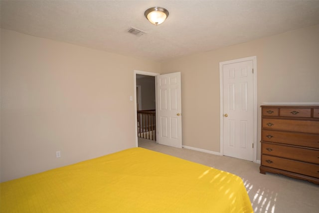 unfurnished bedroom with light colored carpet