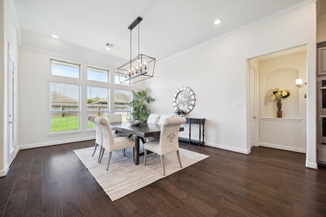 dining area featuring ornamental molding, dark hardwood / wood-style floors, and a notable chandelier