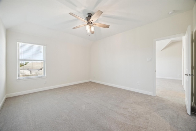 spare room with light colored carpet and ceiling fan