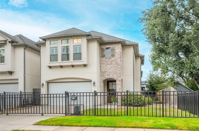 view of front of home featuring a garage and a front lawn