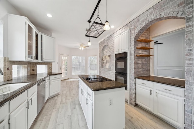 kitchen featuring a center island and white cabinets