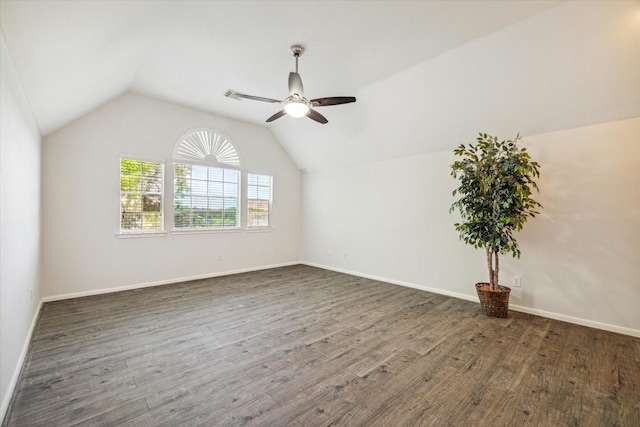 additional living space with lofted ceiling, dark wood-type flooring, and ceiling fan