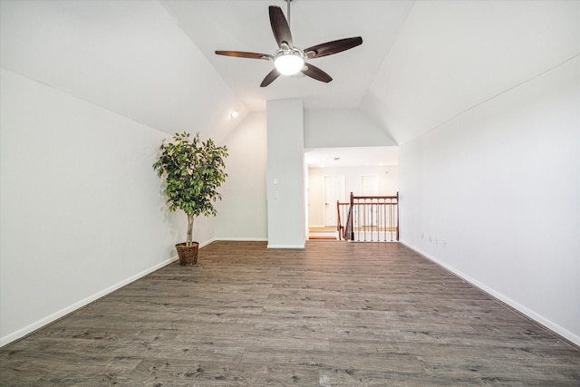 additional living space with dark hardwood / wood-style flooring and vaulted ceiling