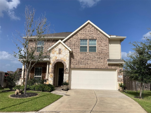 view of front of home featuring a garage and a front yard