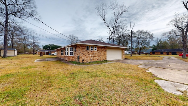 view of property exterior with a garage and a yard