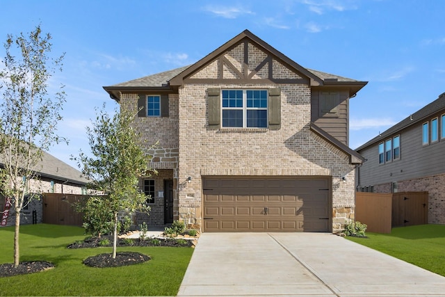 view of front facade with a garage and a front lawn