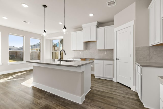 kitchen with white cabinetry, sink, and dark hardwood / wood-style floors