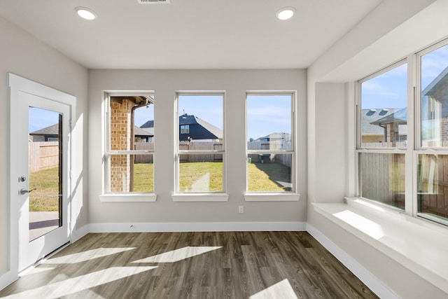 unfurnished sunroom with plenty of natural light