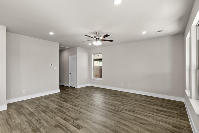 unfurnished room with ceiling fan and dark hardwood / wood-style floors