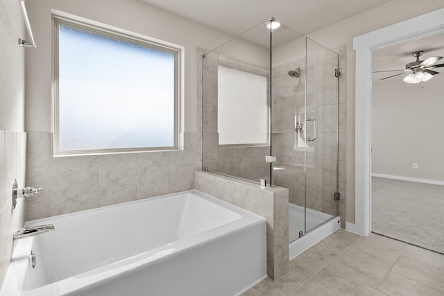 bathroom featuring a wealth of natural light, tile patterned floors, independent shower and bath, and ceiling fan