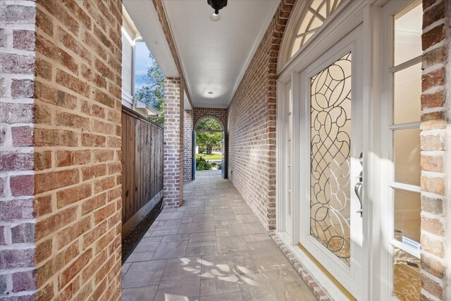 interior space featuring brick wall