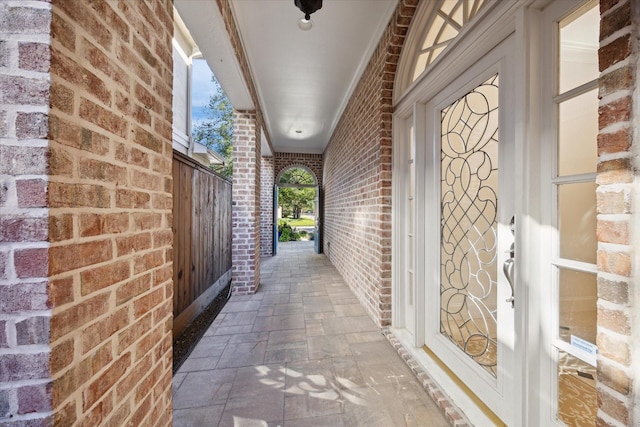 entrance to property with brick siding