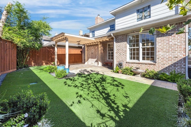 view of yard with a patio area and a pergola