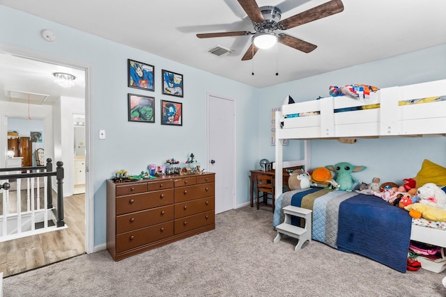 bedroom with ceiling fan and light colored carpet