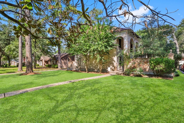 view of front of home with a front lawn