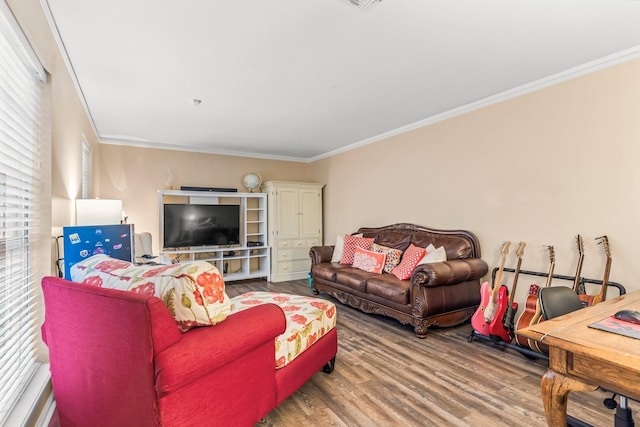 living room featuring ornamental molding and hardwood / wood-style floors