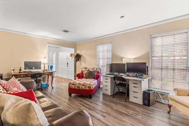 office featuring ornamental molding, plenty of natural light, and hardwood / wood-style floors