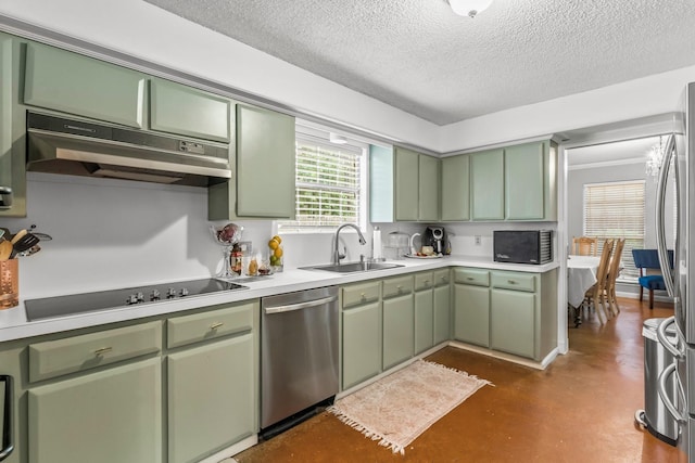 kitchen featuring sink, a textured ceiling, green cabinetry, and appliances with stainless steel finishes