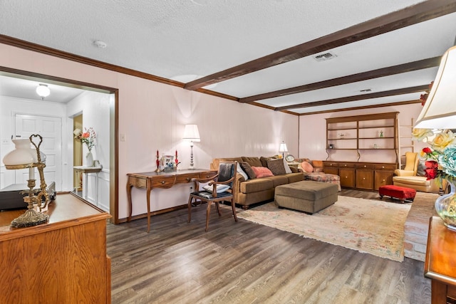 living room featuring dark wood-type flooring, beam ceiling, and a textured ceiling