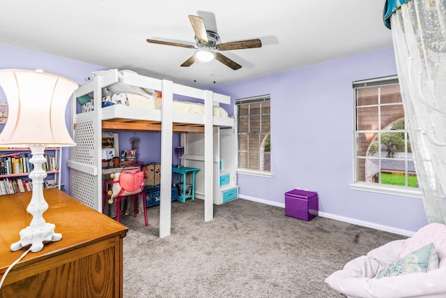 bedroom with ceiling fan and carpet