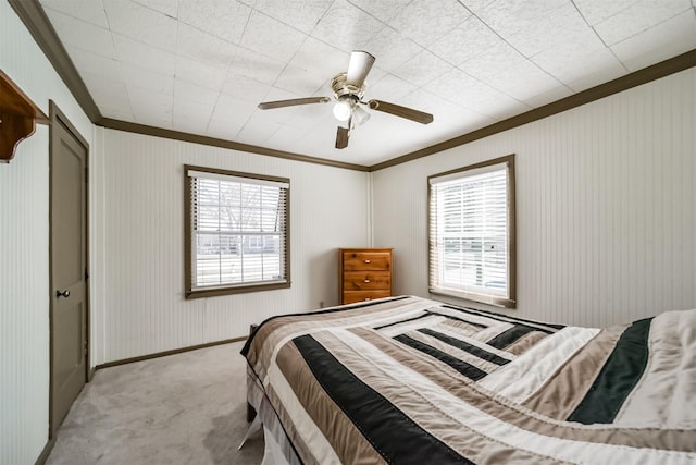 5411 Pecan St, Crosby, TX 77532 - bedroom featuring ceiling fan, ornamental molding, a closet, and light carpet