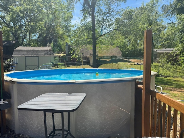 view of pool with a shed