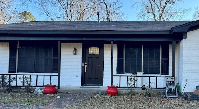 entrance to property with a porch