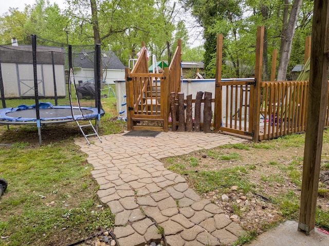 1406 E Brazos St, Palestine, TX 75801 - view of yard with a trampoline and a playground