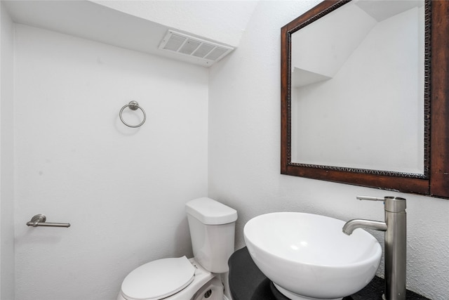 bathroom featuring sink and toilet