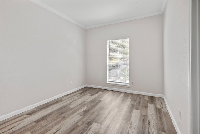 unfurnished room with light hardwood / wood-style flooring and ornamental molding