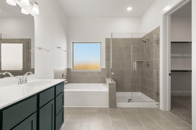 bathroom with vanity, tile patterned floors, and separate shower and tub