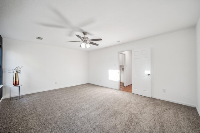 empty room with carpet and ceiling fan