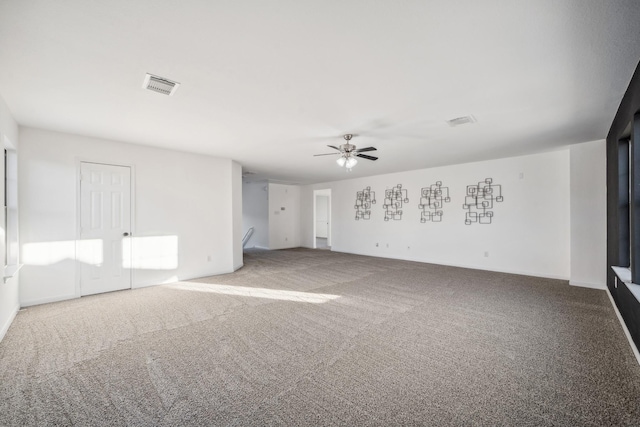 unfurnished room with carpet flooring and ceiling fan