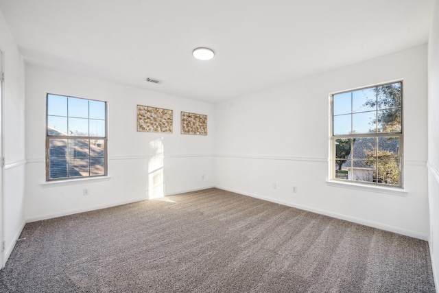 spare room featuring carpet floors