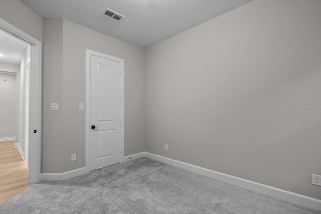 empty room with light carpet