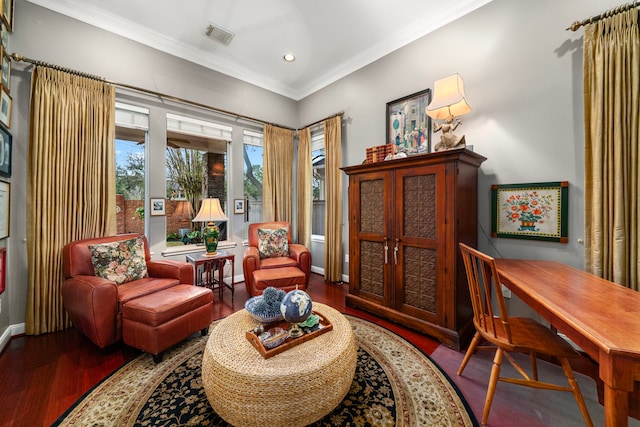 sitting room featuring hardwood / wood-style floors and crown molding