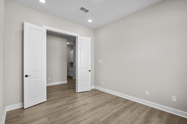 unfurnished bedroom featuring light hardwood / wood-style flooring