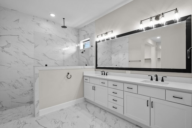 bathroom with vanity and tiled shower