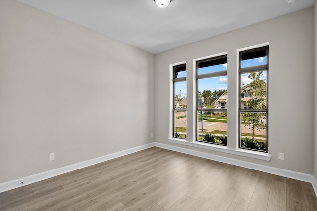 unfurnished room featuring light hardwood / wood-style flooring