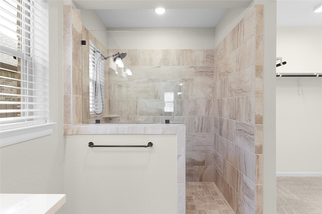 bathroom with tiled shower