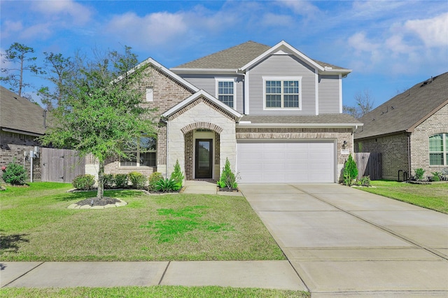 view of front of property featuring a garage and a front yard