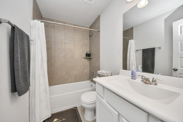 full bathroom featuring vanity, toilet, and shower / tub combo