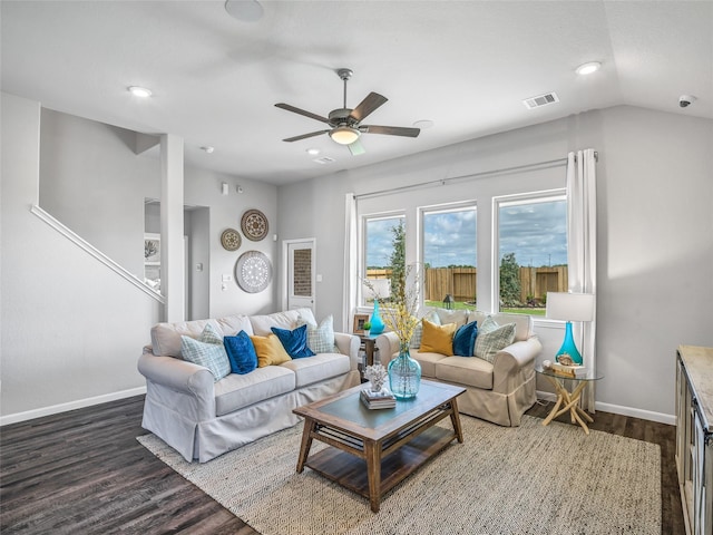 living room with vaulted ceiling, dark hardwood / wood-style floors, and ceiling fan